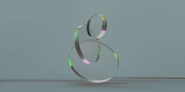 3D rendered round shapes in transparent material on a light back