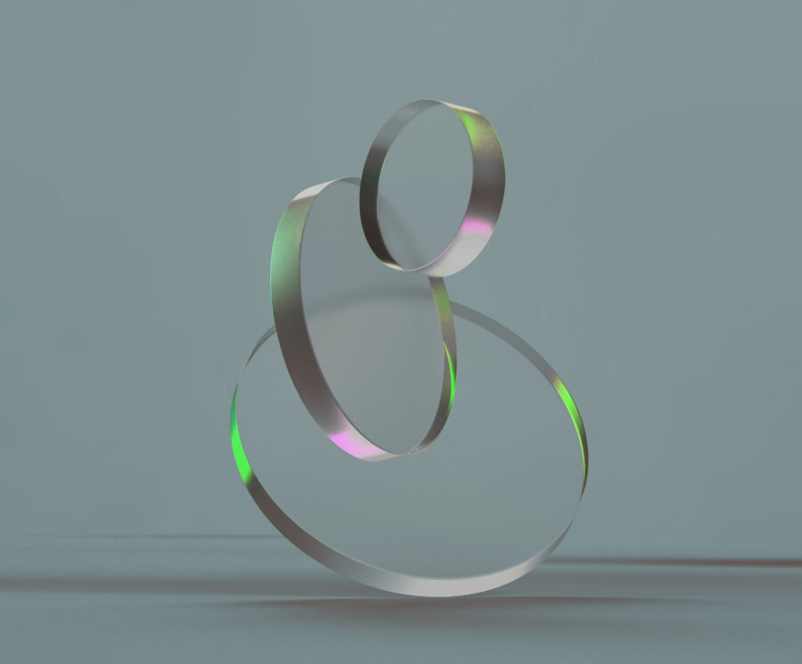 3D rendered round shapes in transparent material on a light back