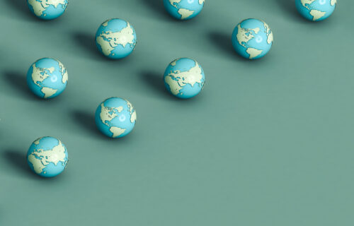 Planet earth on a green background. 3d render illustration. copy space in the bottom right corner.