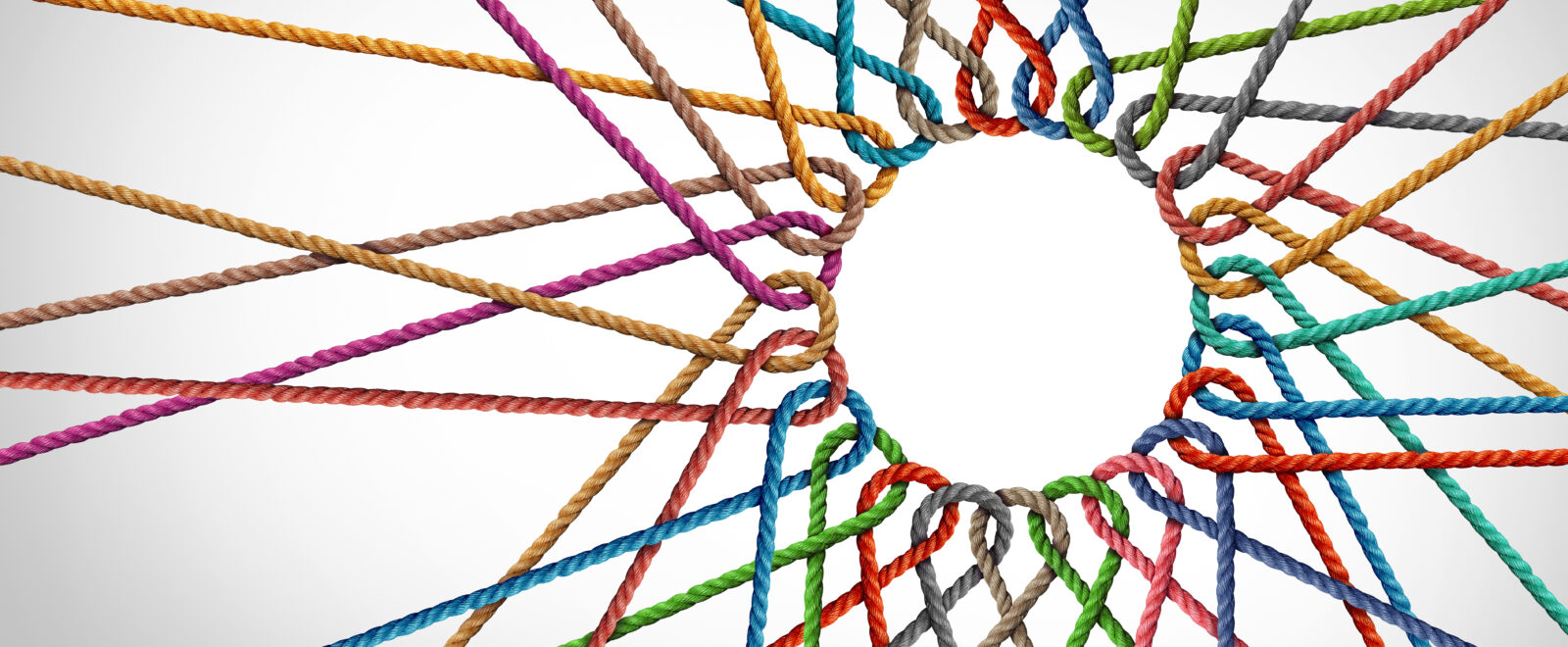 Abstract image showing interconnecting ropes of differing colours on a white/grey background