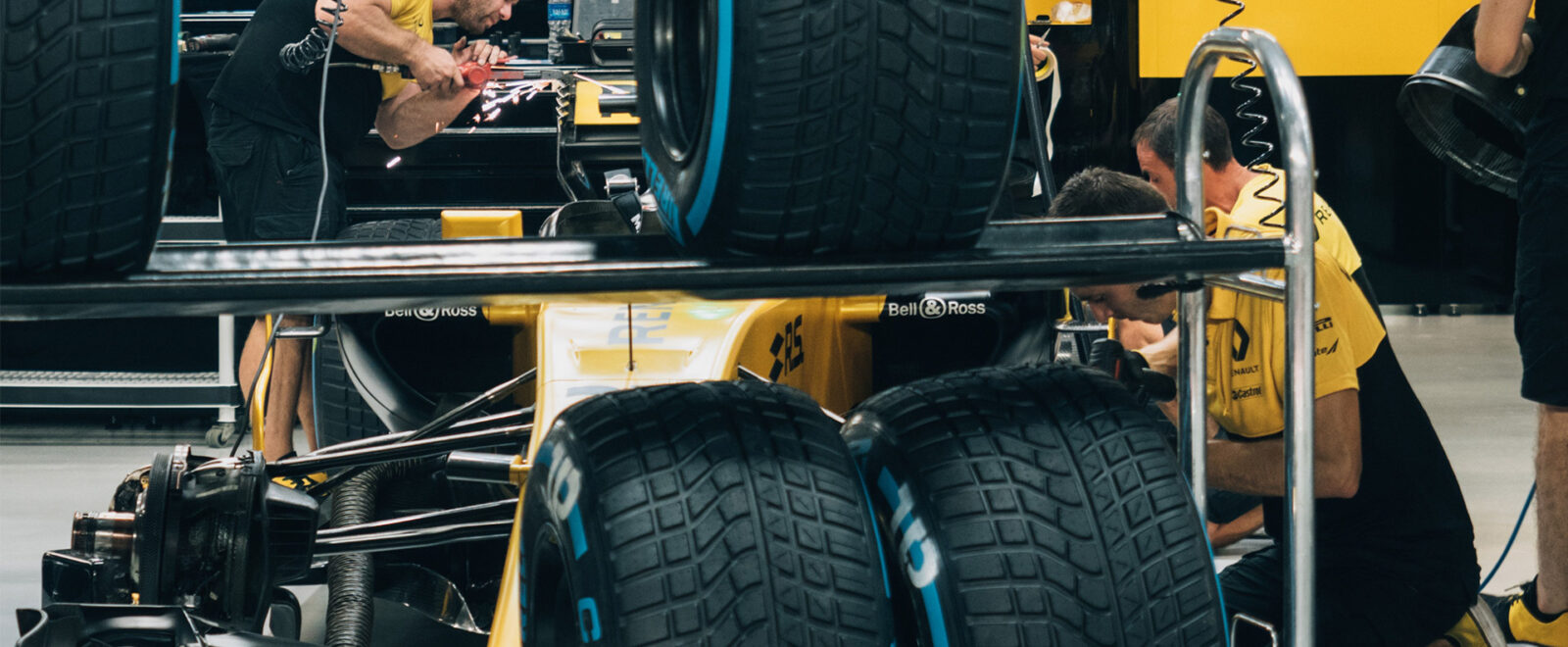 Engineers working on Renault Formula One car