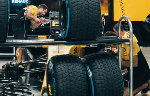 Engineers working on Renault Formula One car