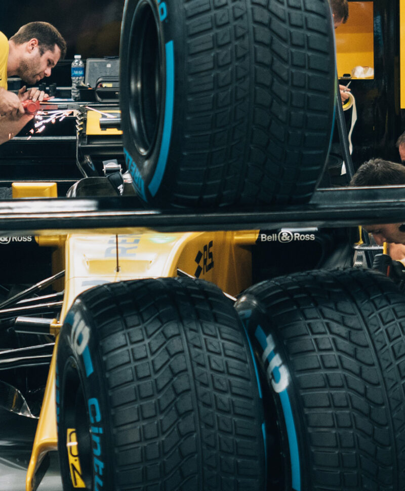 Engineers working on Renault Formula One car