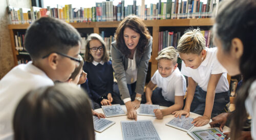 Teacher and children using technology in the classroom