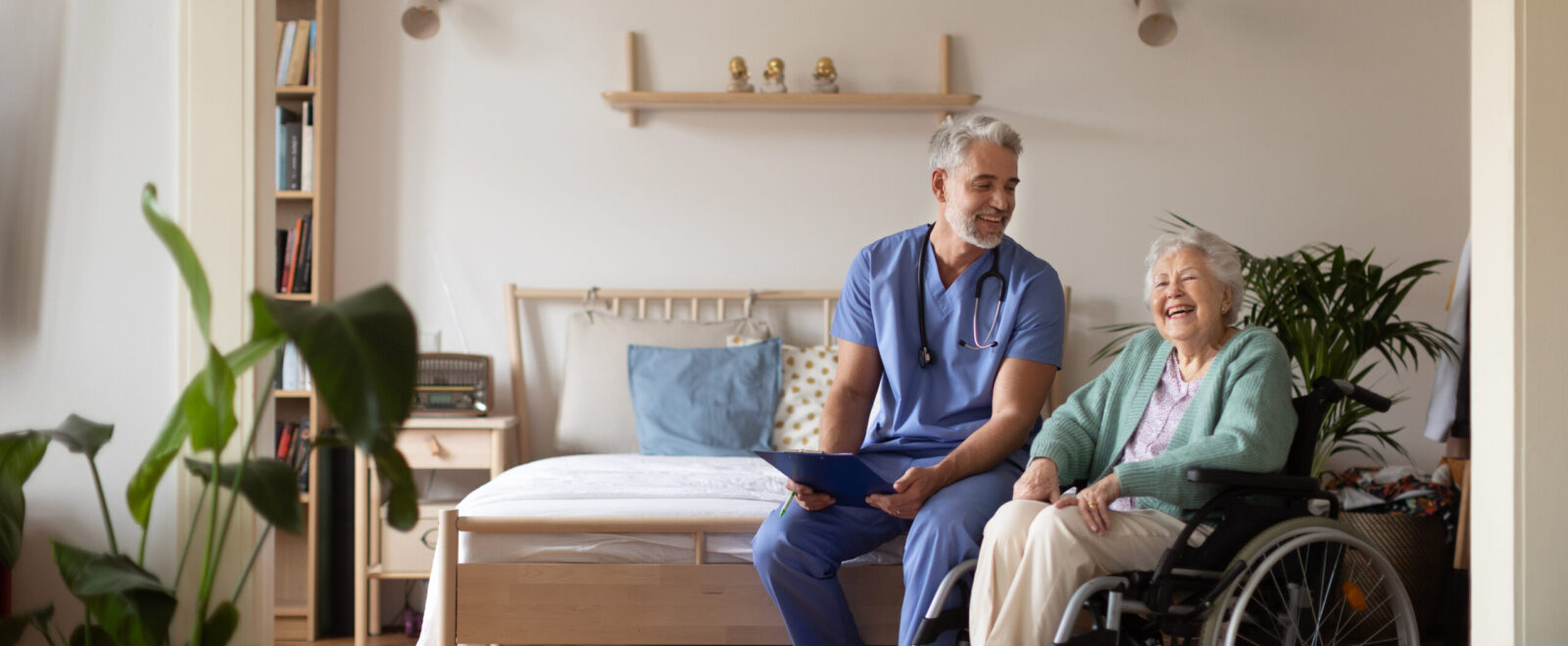 Carer giving healthcare services to an elderly lady in her own home