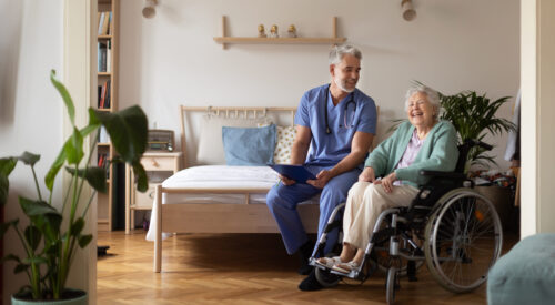 Carer giving healthcare services to an elderly lady in her own home