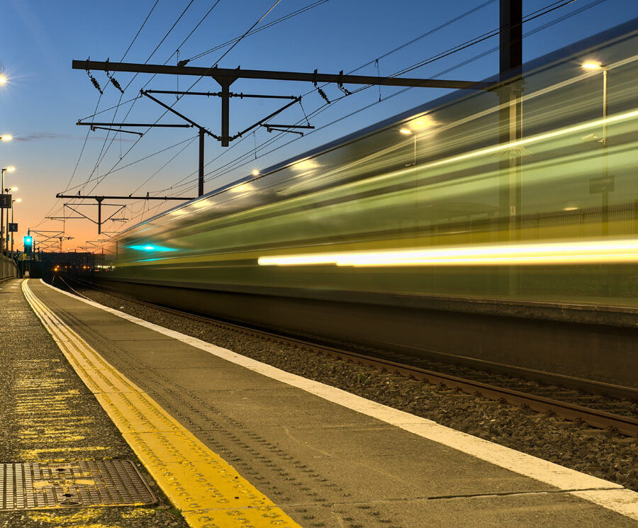 railway station and colorful sky at Blackrock in the evening, Dublin, Ireland. Long exposure shot of the coming train