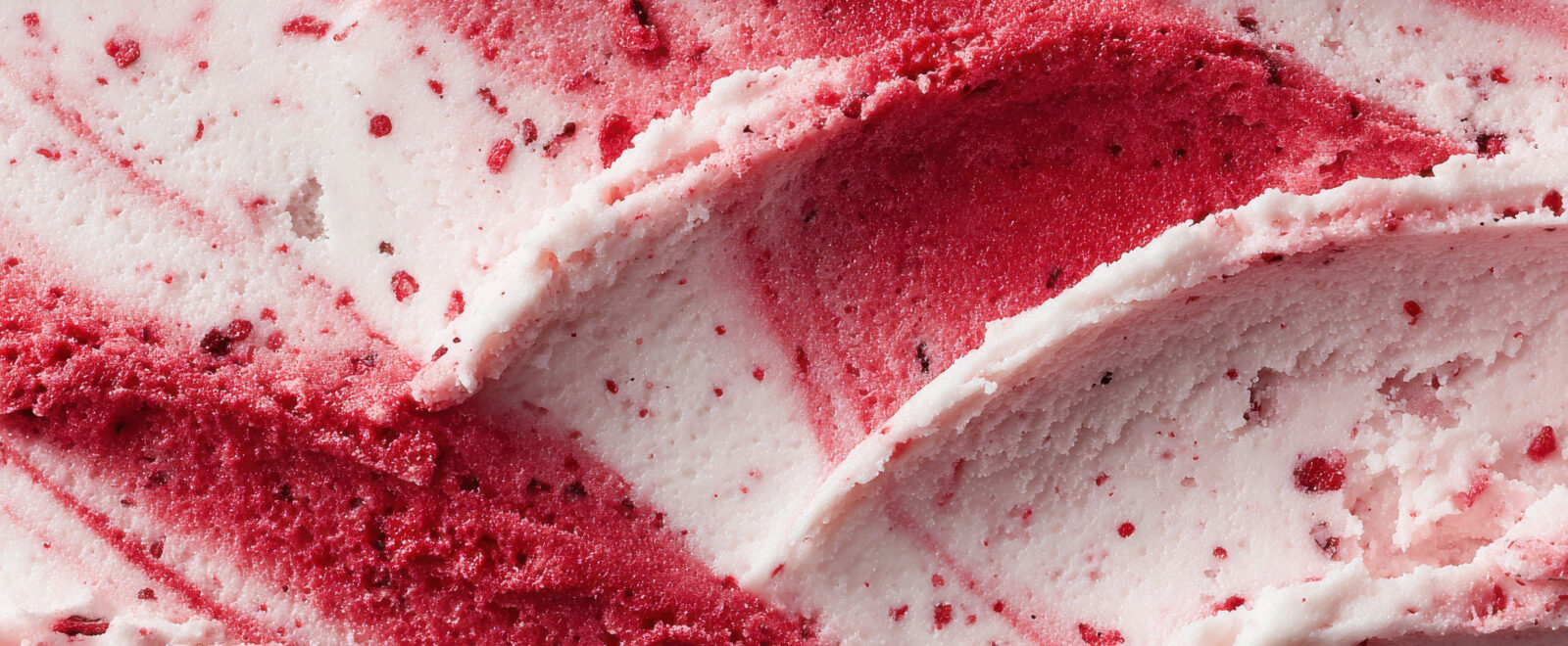 A close-up of raspberry ripple ice cream