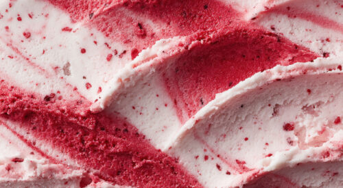 A close-up of raspberry ripple ice cream